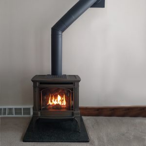 fire place displayed on a stand on carpet